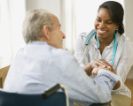 Nurse and elderly man spending time together